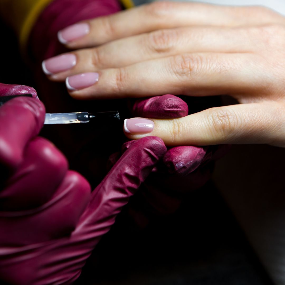 Nail tech painting nails