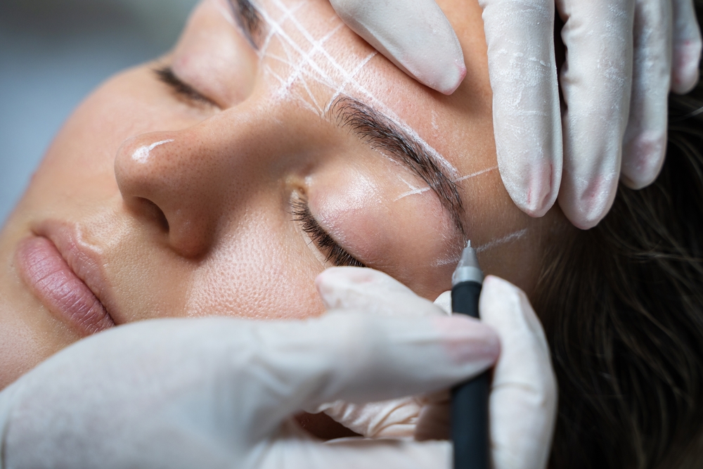young,woman,during,professional,eyebrow,mapping,procedure,before,permanent,makeup