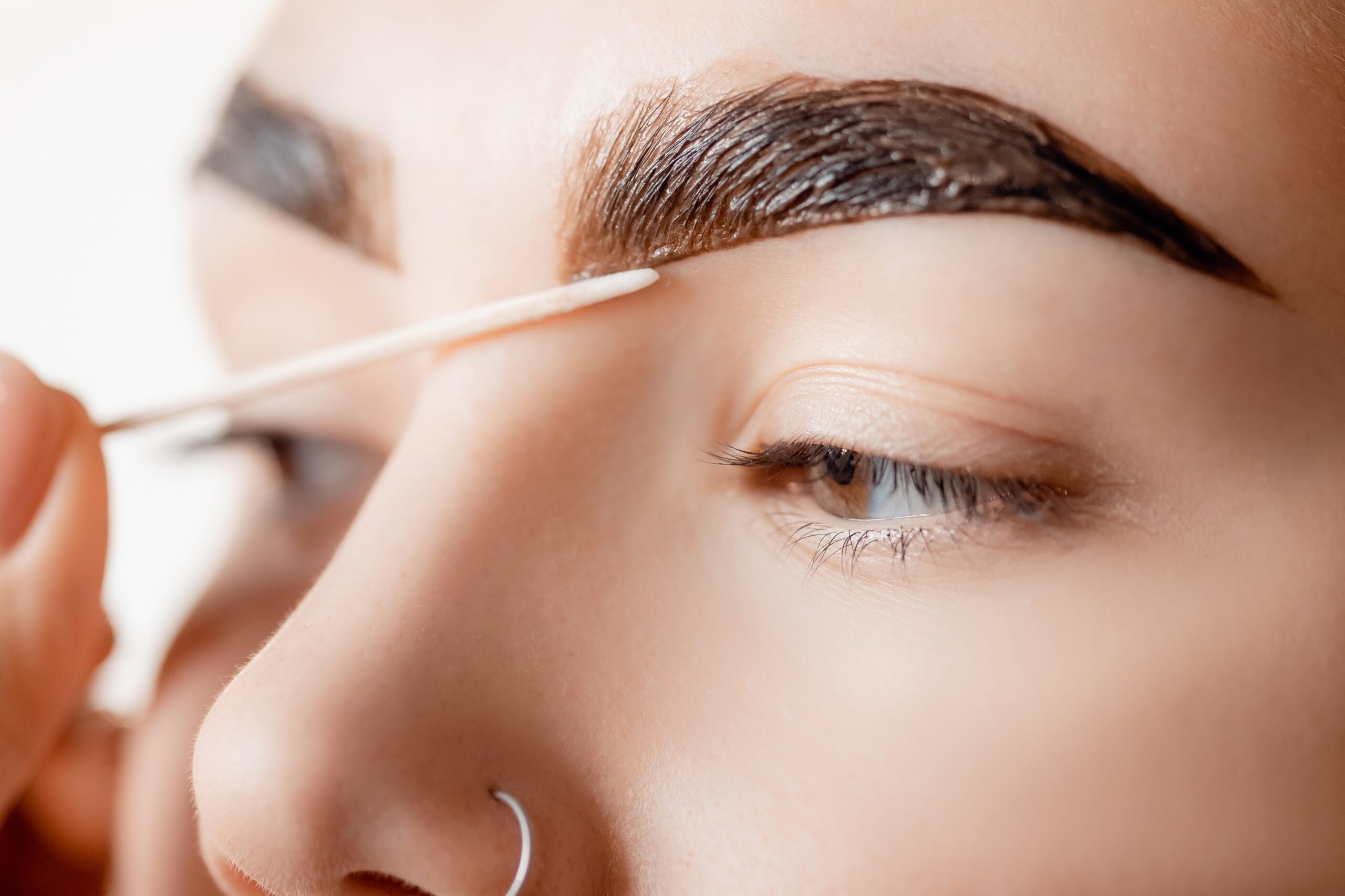 correction,and,tint,henna,of,eyebrows,,master,applies,brush,to