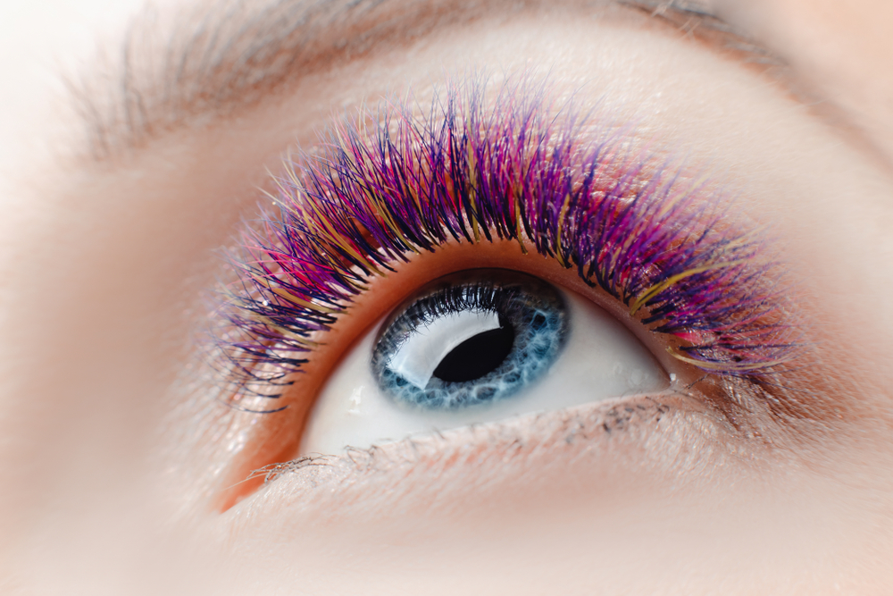eyelash,extension,procedure.,beautiful,woman,with,long,colored,hairs,lash