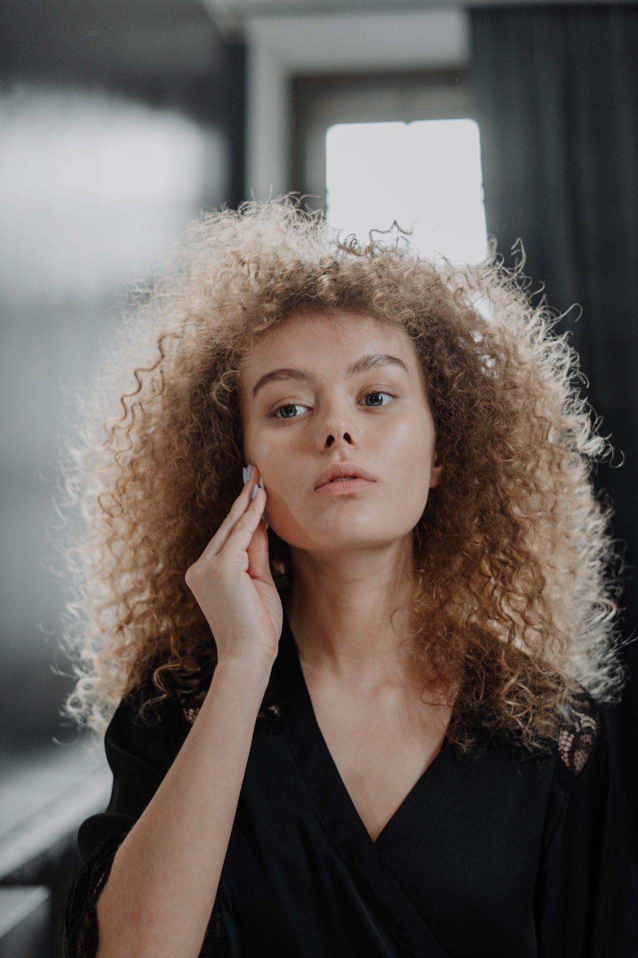 woman cleaning her face
